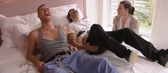 Two Men Simulate Childbirth Contractions with Electrodes